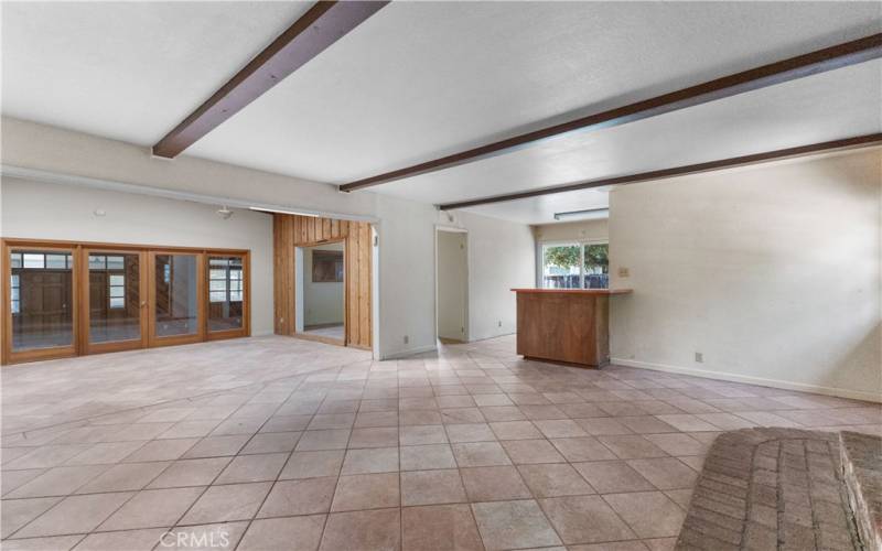 The entry room flows into the kitchen and living rooms.