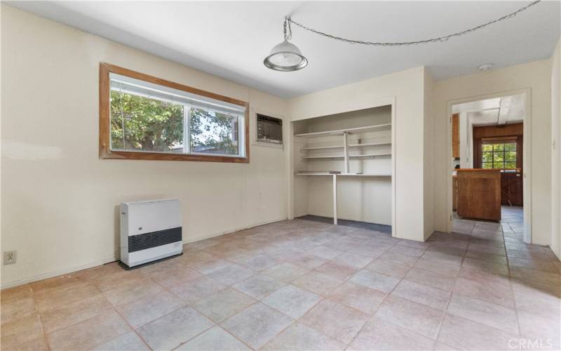 The dining room features shelving/storage space.