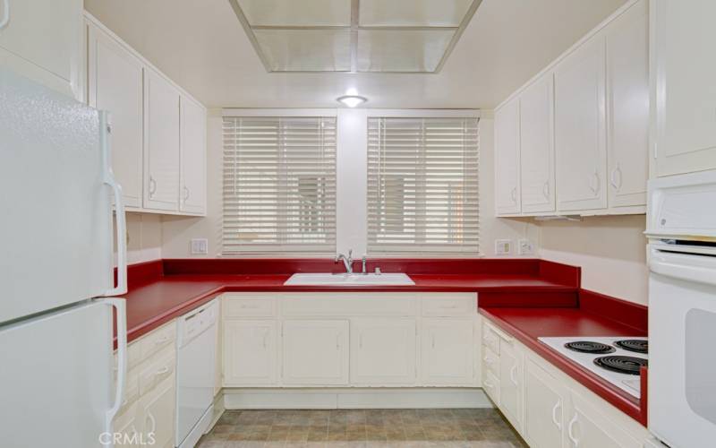 Kitchen features ample cabinet and countertop space.