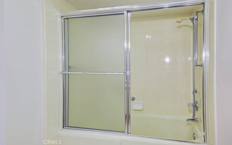 Primary bathroom has a tub/shower combo.