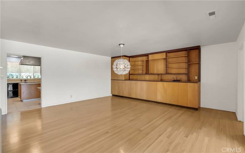 From the kitchen, you walk into the formal dining area large enough to accommodate a huge family table, adjacdent to an enormous built-in shelving/drawer unit. as well as a hidden wet bar (water does not work, but a great place to store liquor).