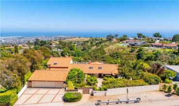 Aerial view of home, driveway and view.