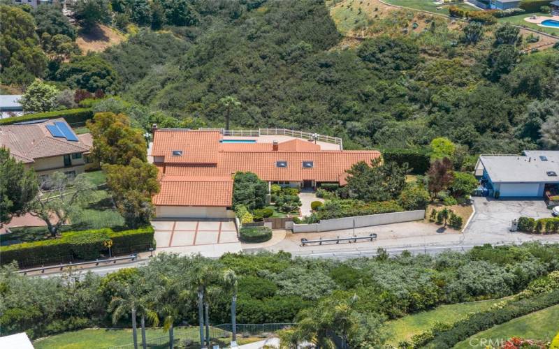 Aerial street view of home and canyon