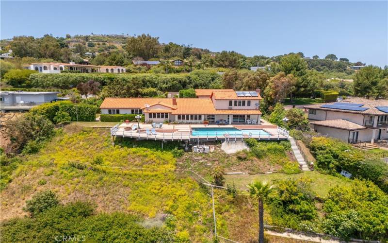 Aerial view of house, pool and deck from canyon