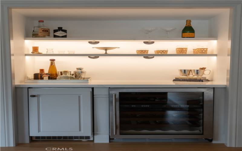 Bar with wine refrigerator and ice maker, located in Family Room.