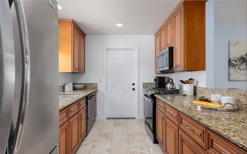 Galley style kitchen with direct garage access