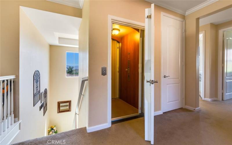 Same Elevator brings you up to all your spacious upstairs living areas. Door at right is a hall closet