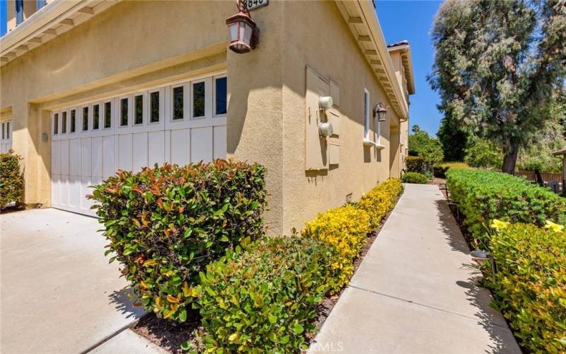 Upper residence entrance is via right side walk. HOA maintains front/side/back landscaping for Trilogy Townhome owners