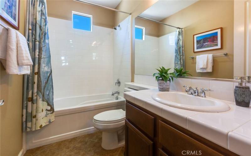 Attractive Guest Bathroom is outside Guest Bedroom has Tub/Shower Combo for 