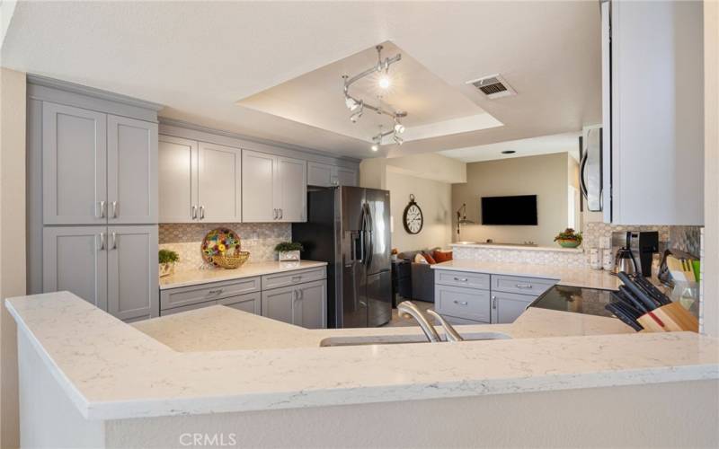 Beautiful kitchen with quartz counter tops and updated stainless steel appliances