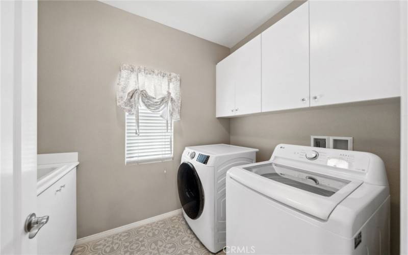 upstairs laundry room with sink