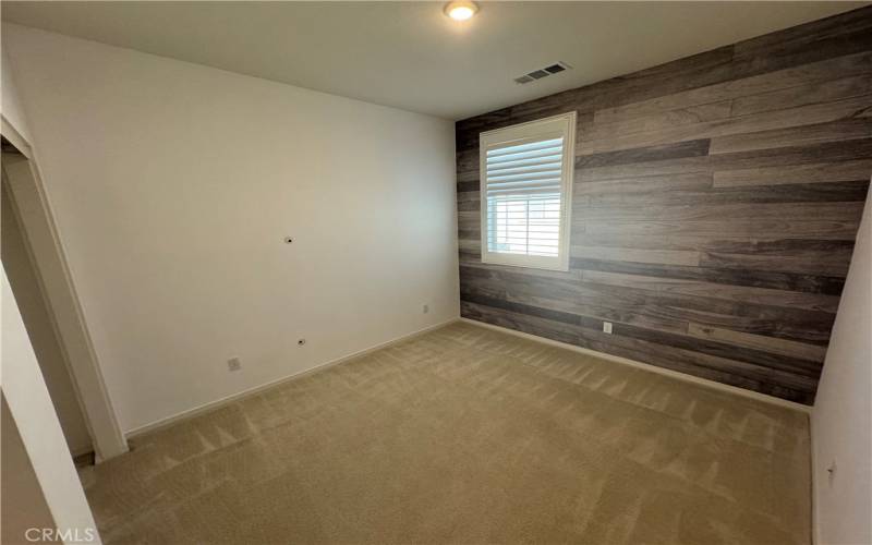Converted bedroom upstairs, currently used as an office with stylish shiplap walls.
