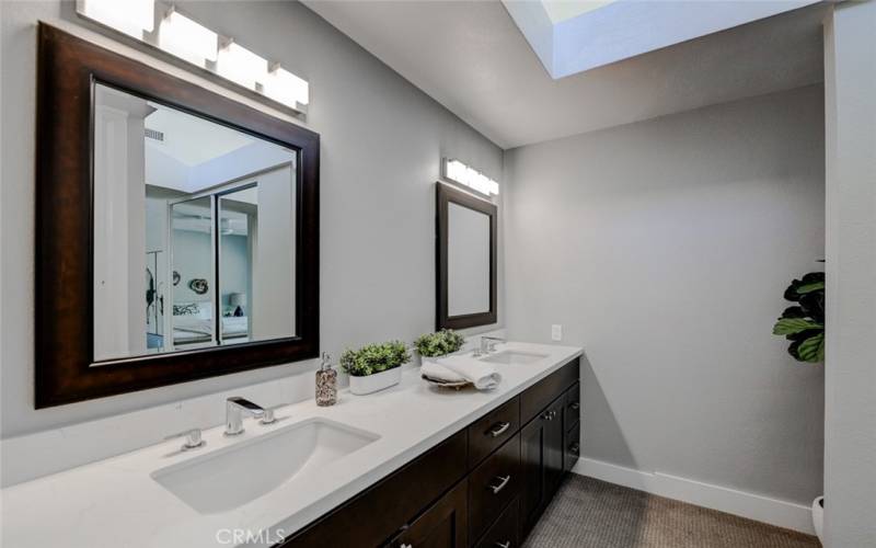 Upper windows give fantastic lighting to the primary bathroom.
