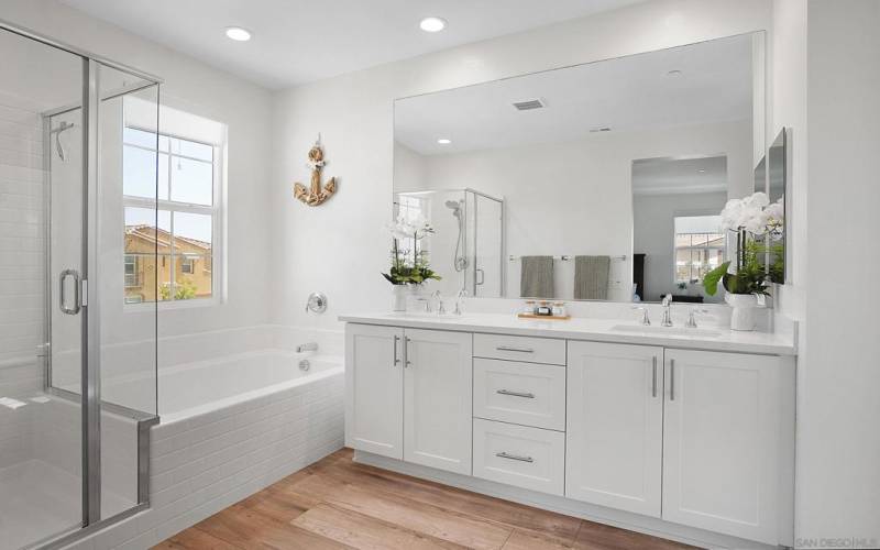 Primary Bathroom with Beautiful Flooring, Cabinets and Countertops!