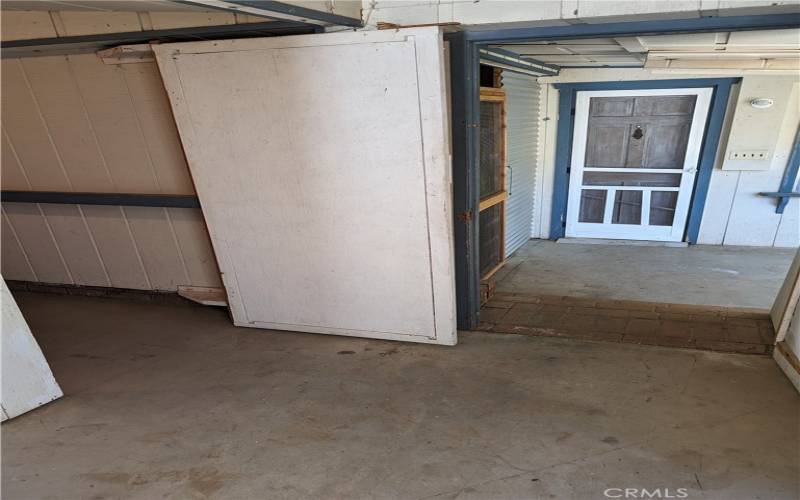 To the left, the way to the laundry area and guest space entrance.