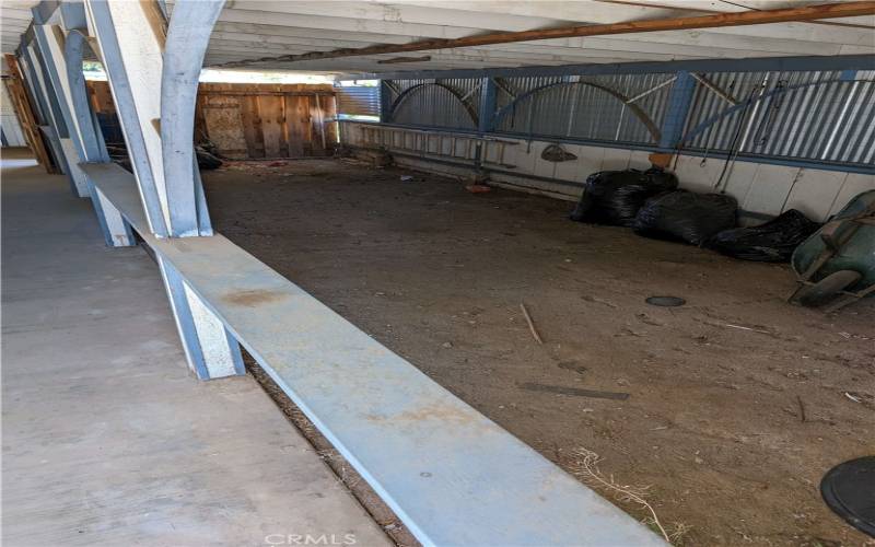 Tandem Carport secured by a door