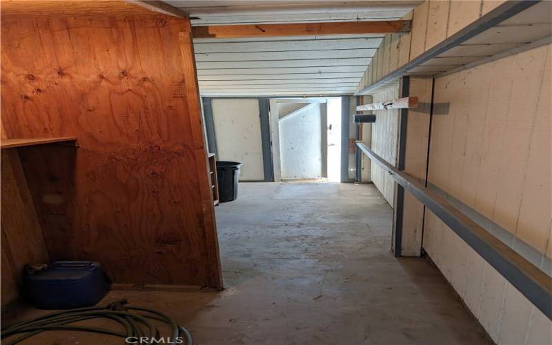 Off breezeway, leads to laundry area and entrance to guest space.