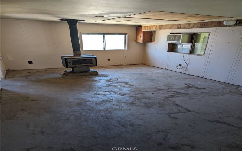 Living room: Wood burning stove and swamp cooler included.