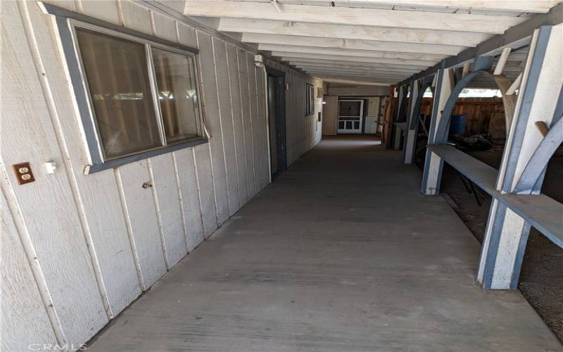 Covered breezeway with access to garage, guesthouse and the main house.