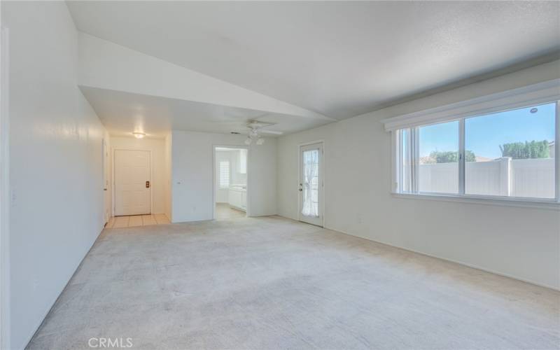 Living room looking toward front door and dining area