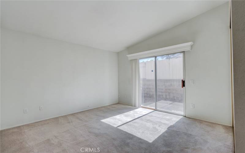 Secondary bedroom with sliding door to backyard