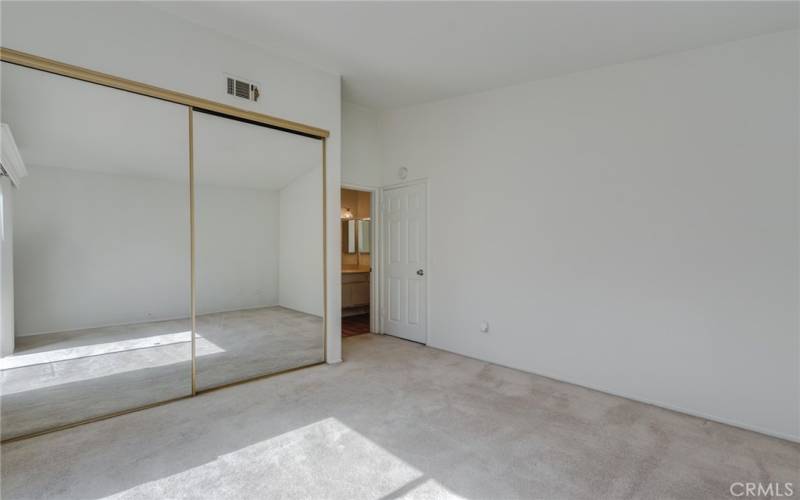 Secondary bedroom mirrored closet doors