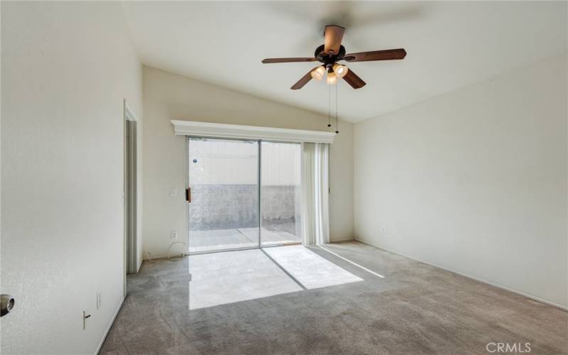 Primary bedroom with sliding glass door