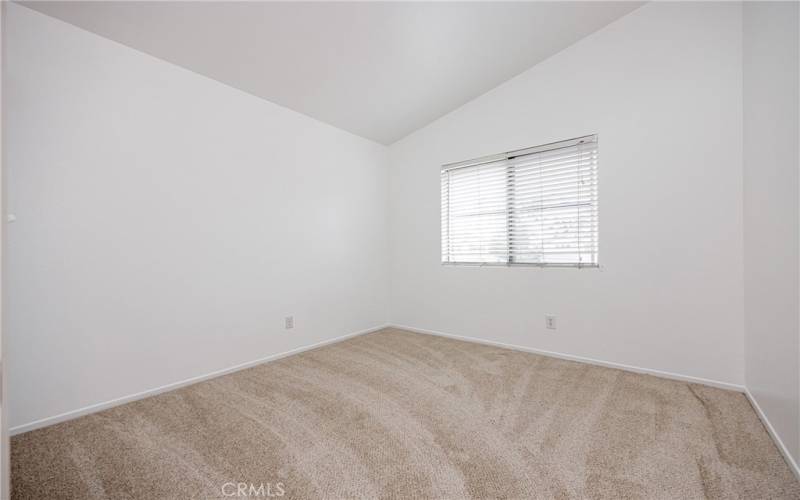 Primary bedroom suite with new carpet