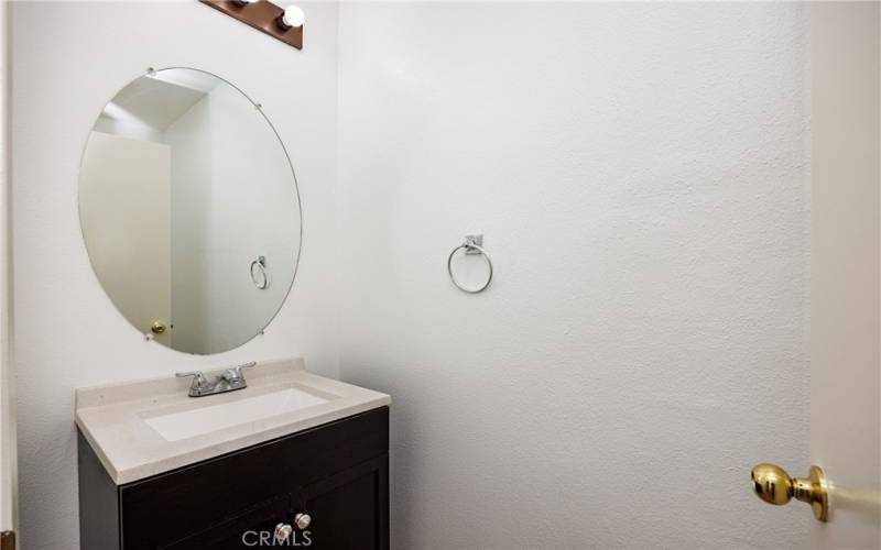 Half bathroom on near kitchen and laundry room