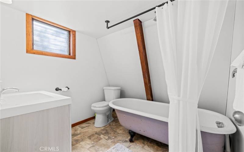 Bathroom on the second floor has traditional claw foot tub.