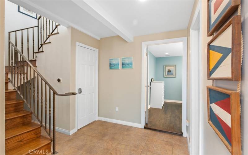 Hallway leading to bunkroom and stairs to upper level.