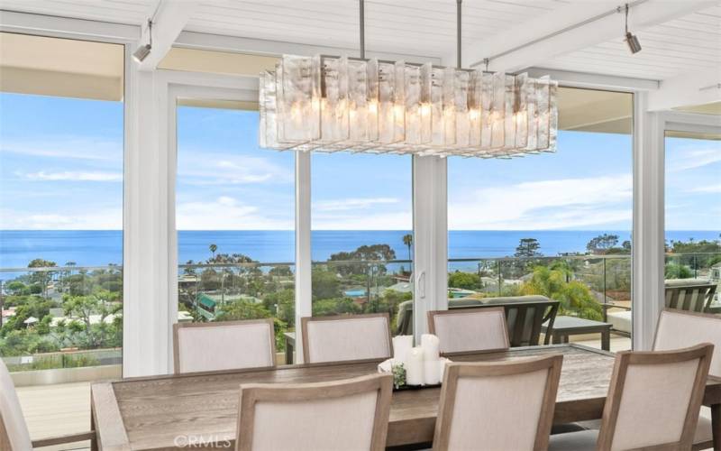 Dining area looking out to upper deck and Pacific Ocean.