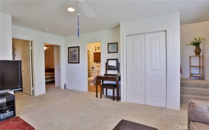 Family room looking at bedrooms, bathroom and laundry closet