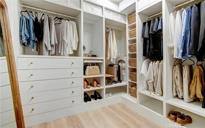 Primary walk-in closet :organized to it's fullest!