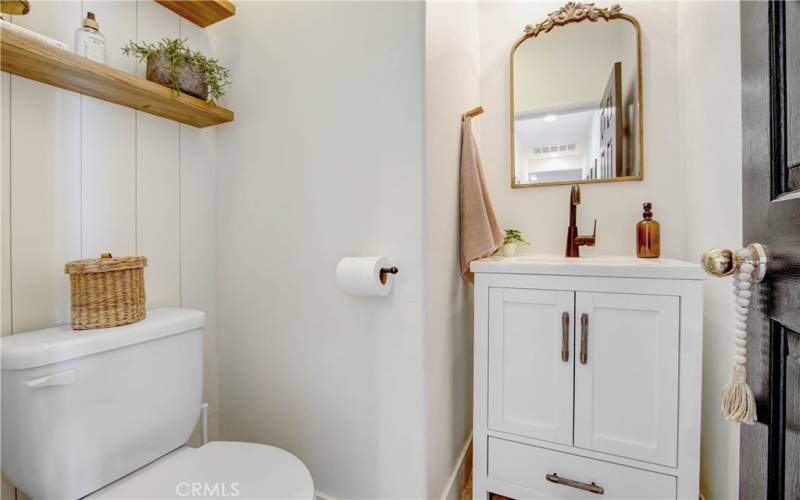 Powder room in hallway.