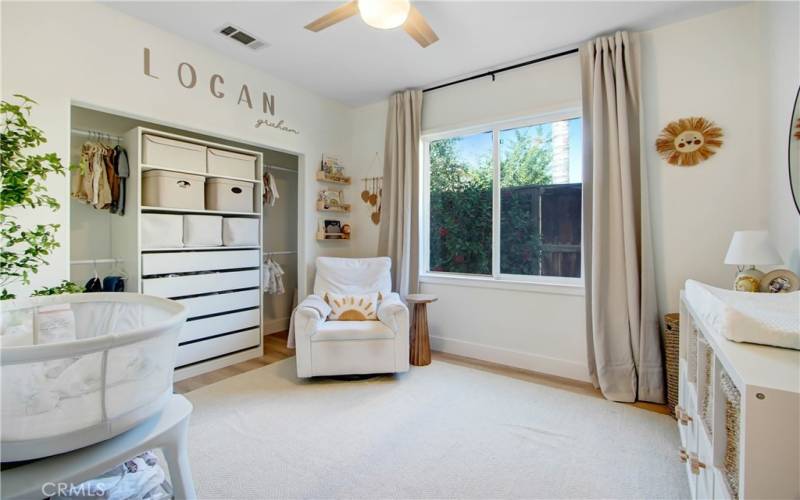 Bedroom #2 of 3 : beautiful laminate flooring and ceiling fans.