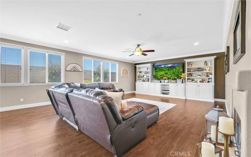 FAMILY ROOM WITH FIRPLACE AND BUILT IN ENTERTAINMENT CENTER