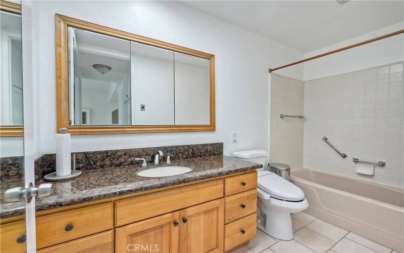 Lovely remodeled bath with granite counters & newer cabinetry