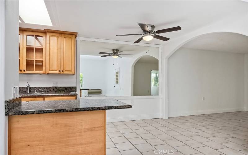 Large kitchen island with in-kitchen dining area & ceiling fan
