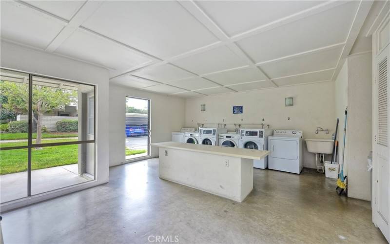 Large laundry is steps from home & provides enclosed area with clothes line