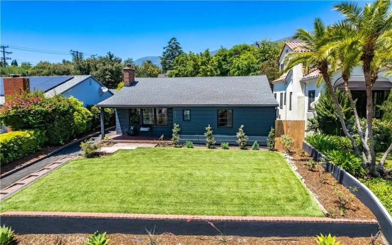 Aerial view of the house with landscaped yard