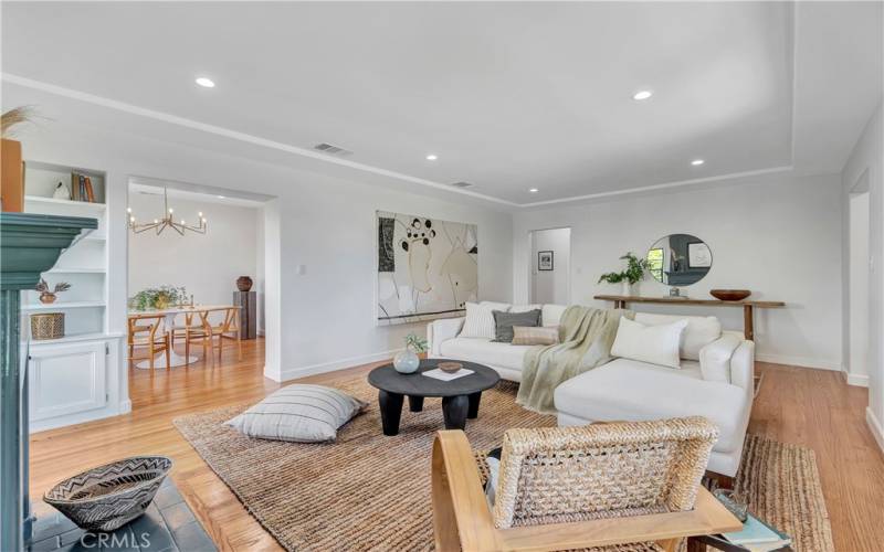 Living/Family room with raised tray ceiling and recessed lights