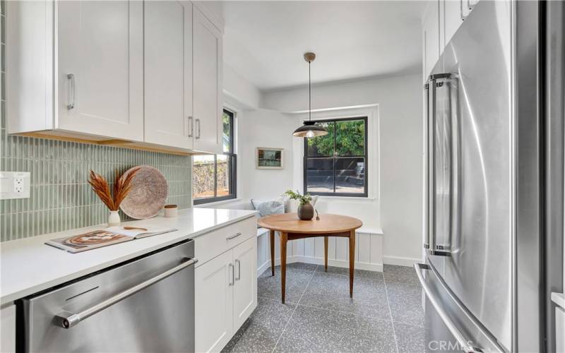 Kitchen with quartz counters, vertical porcelain backsplash, soft-close cabinets and a new french door refrigerator