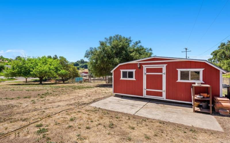 Large storage shed with side ramp access.