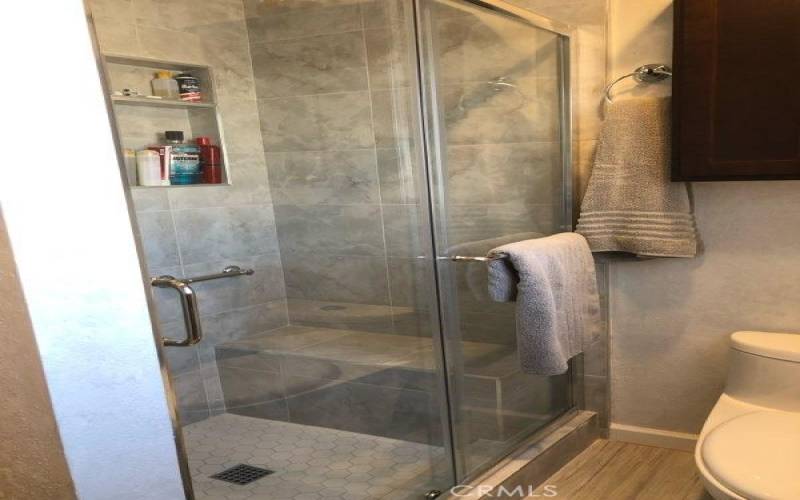 Primary Bathroom - seat & safety bar in shower