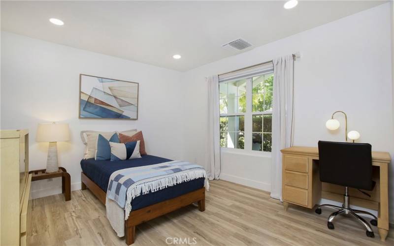 bedroom  3 or could be an office, lovely flooring ,and bright window.
