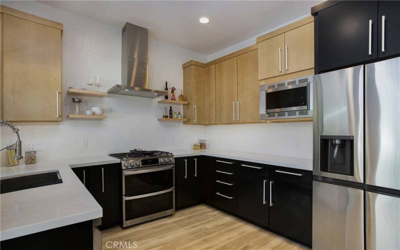 Enjoy a new completely remodeled kitchen, double ovens, soft close cabinetry with pulls, pull out storage shelves.Lazy Susans.