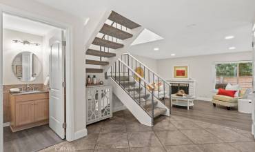 Spacious entry with access to the living room, powder room and stairs that lead to bedrooms and bathrooms