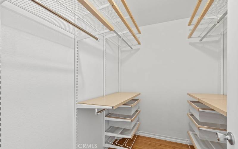 Walk-in closet in Primary Bedroom with custom shelving unit
