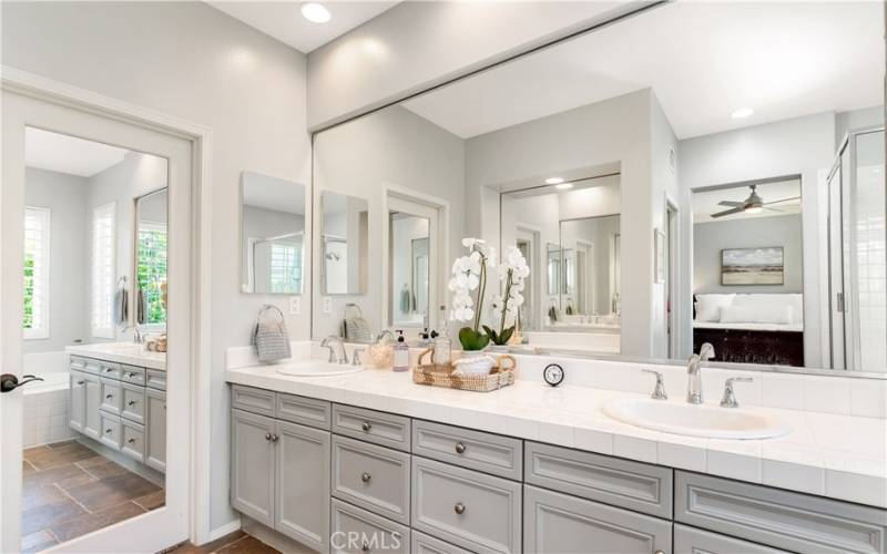 The primary ensuite is sparkling clean with 2 vanity areas and lots of room.